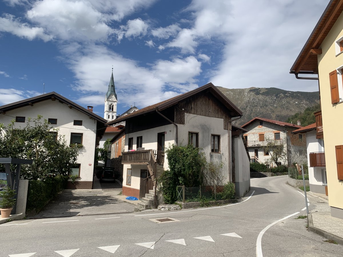 Drevnisca is a typical Slovenian Alpine village with tightly packed houses and a stunning church..